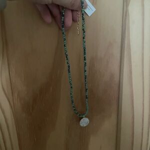I’m selling a park lane necklace with blue beaded chain